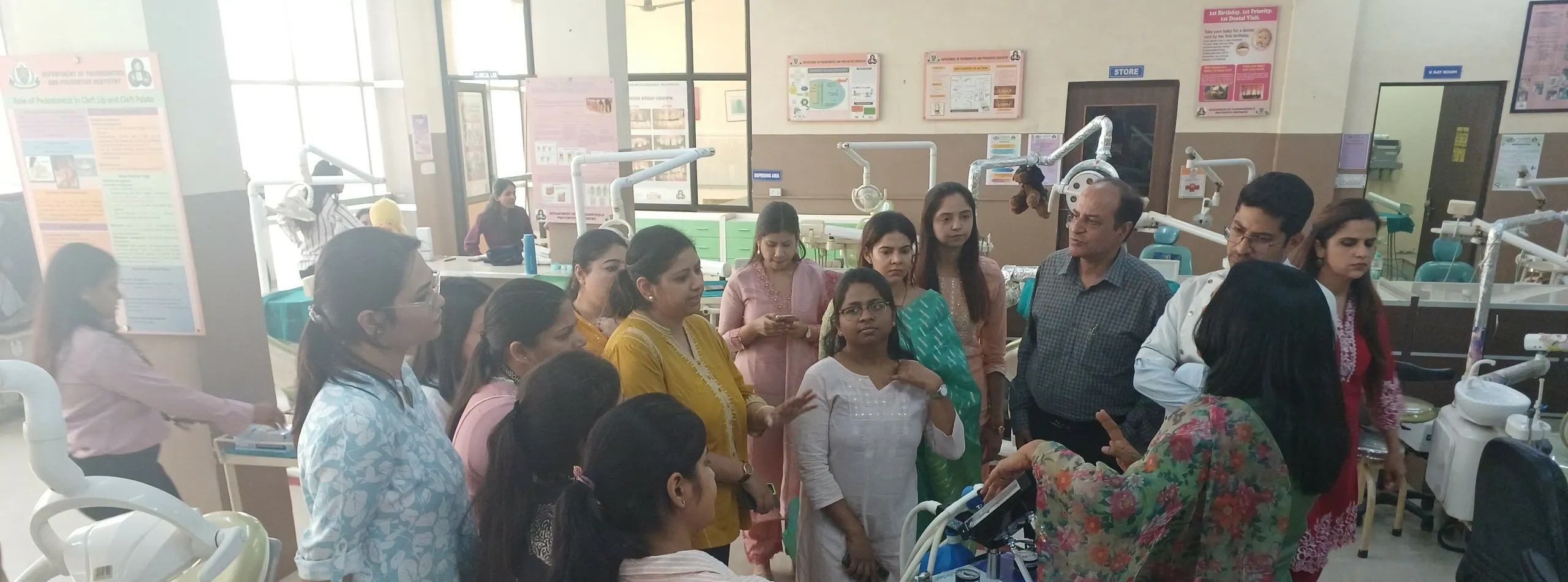 Faculty demonstrating nitrous oxide sedation equipment in the Paedodontics clinic