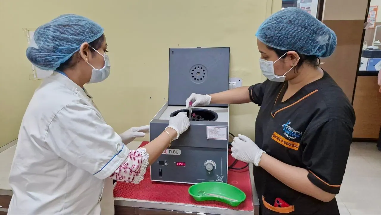 Preparing platelet-rich fibrin in the centrifuge, Department of Periodontology, Inderprastha Dental College